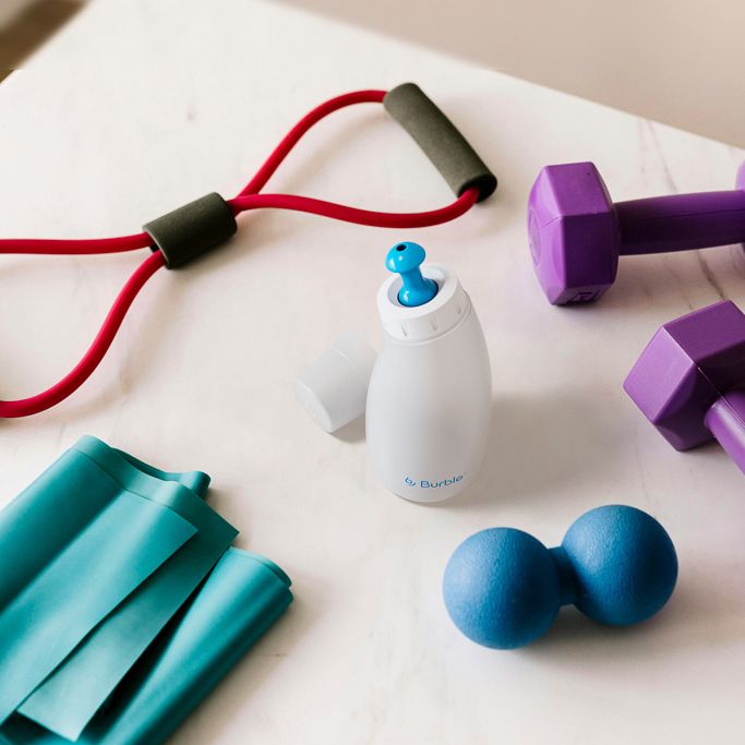Burble bottle next to workout equipment